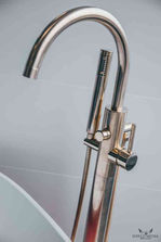 Close-up of curved, chrome tap
