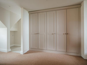 Fitted wardrobes with white doors