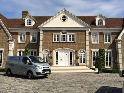 Large building with van parked outside