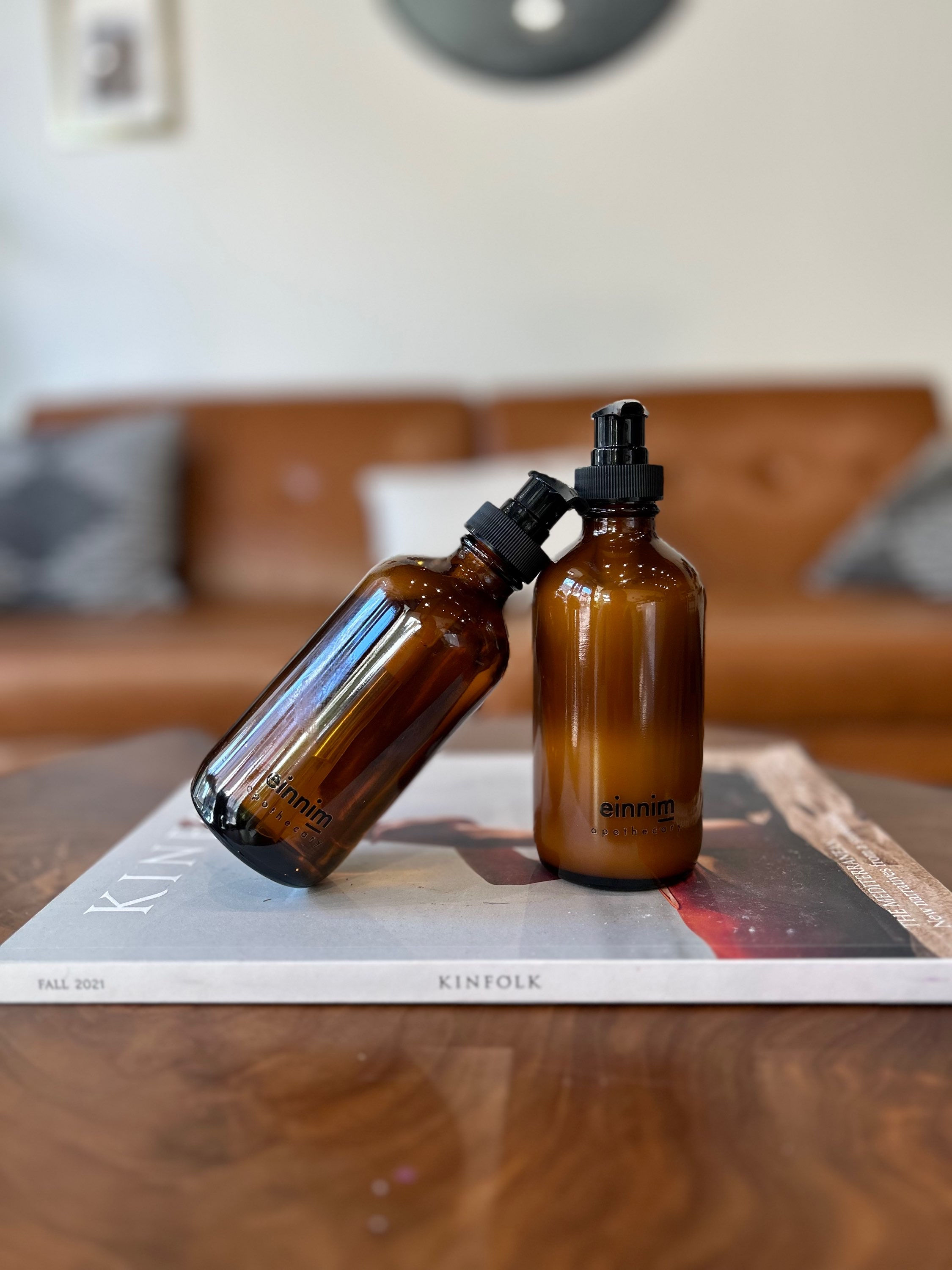 Liquid hand soap and lotion in clear amber bottles