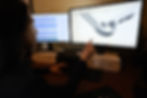 Mech Design Inc. Engineer pointing at SolidWorks CAD Design