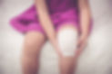 Child injured. Closeup wound on the child's knee with bandage. Shallow depth of field (DOF