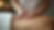 Close-up view of massage therapist’s hands applying gentle pressure on a client’s back