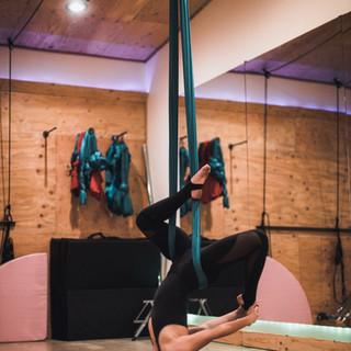 Liv substitute teaches Aerial Strength and Stretch on hammocks at Omni Tahoe in South Lake Tahoe, California.
