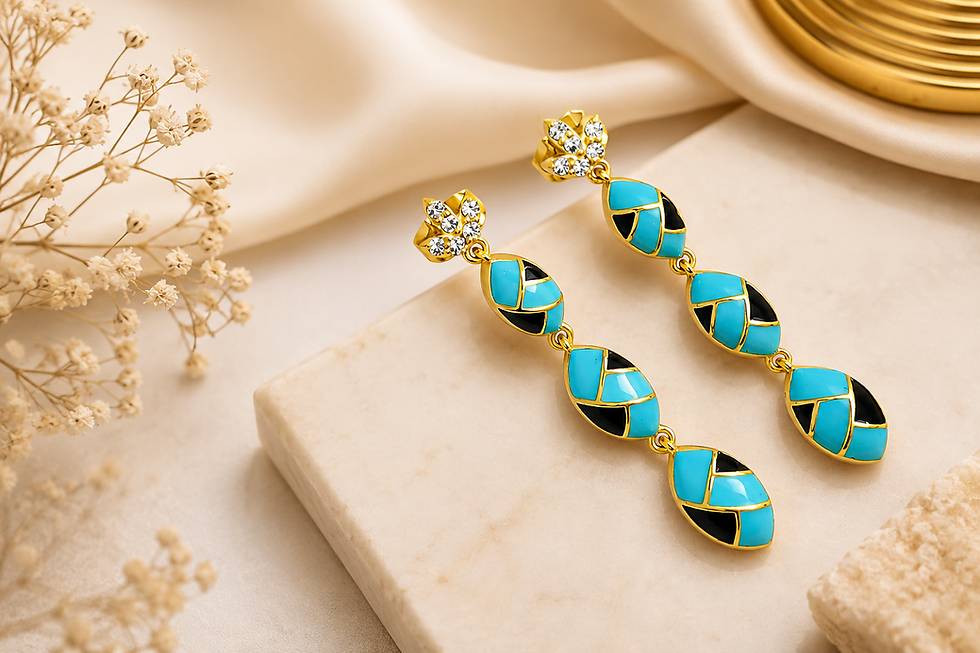 Luxury demi fine gold earrings with turquoise and black enamel details displayed on a marble surface, representing premium Demi Fine Gold Jewelry Wholesale India by Jewels Desire.