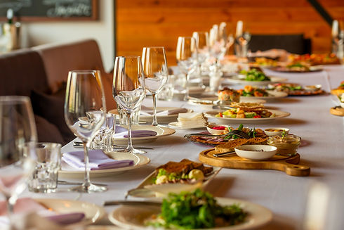 Elegant private dining table with wine glasses and gourmet dishes