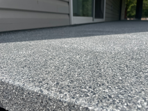 Close-up of a sundeck with a high-gloss polyurethane coating, showcasing a durable, weather-resistant finish.
