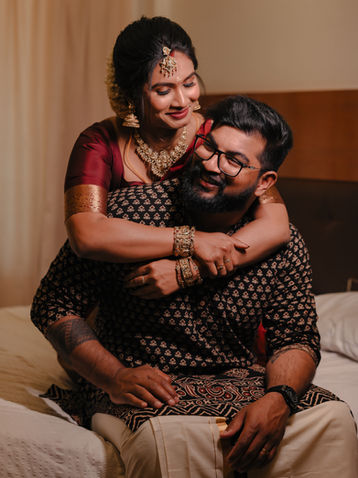 Heartfelt candid moment of a couple in traditional ethnic wear by the best candid wedding photographers in guruvayoor