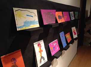 Saturday Art Exhibit_  black paper, box tops as shelves for bookmaking.JPG