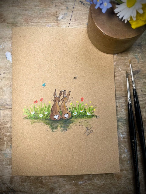 hand painted Hares sitting together in wildflower meadow