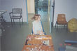 Young girl with red hair sits in children's hospital ward