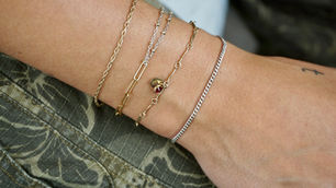 Mixed metal permanent bracelet stack with delicate chain styles