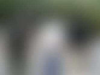 Law enforcement officers escort a suspect during an arrest in a residential neighborhood.