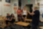 A yearbook adviser is sharing with her yearbook class