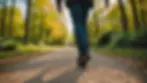 Eye-level view of a person walking on a walking trail