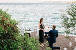 Romantic surprise marriage proposal in Bodrum at sunset with professional photographer capturing emotional moment