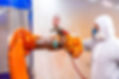 industrial-painter-painting-a-robotic-arm-with-spr-2026-01-07-00-43-52-utc.jpg
