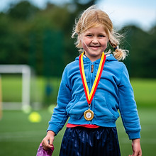 young girl with medal