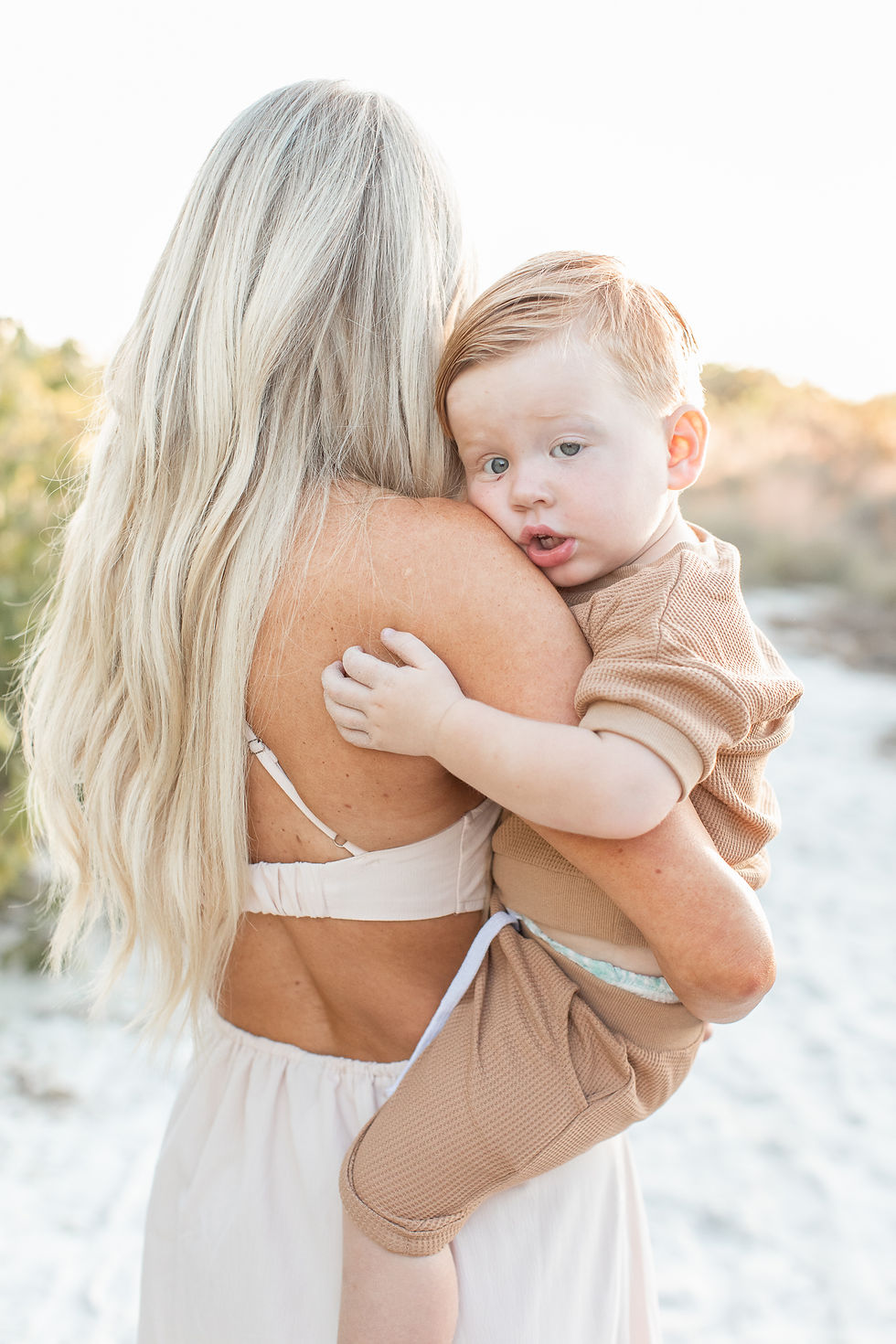 Sarasota Family Photographer | Mother holding child at the beach
