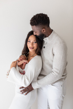 Sarasota Newborn Photographer | mom and dad holding baby