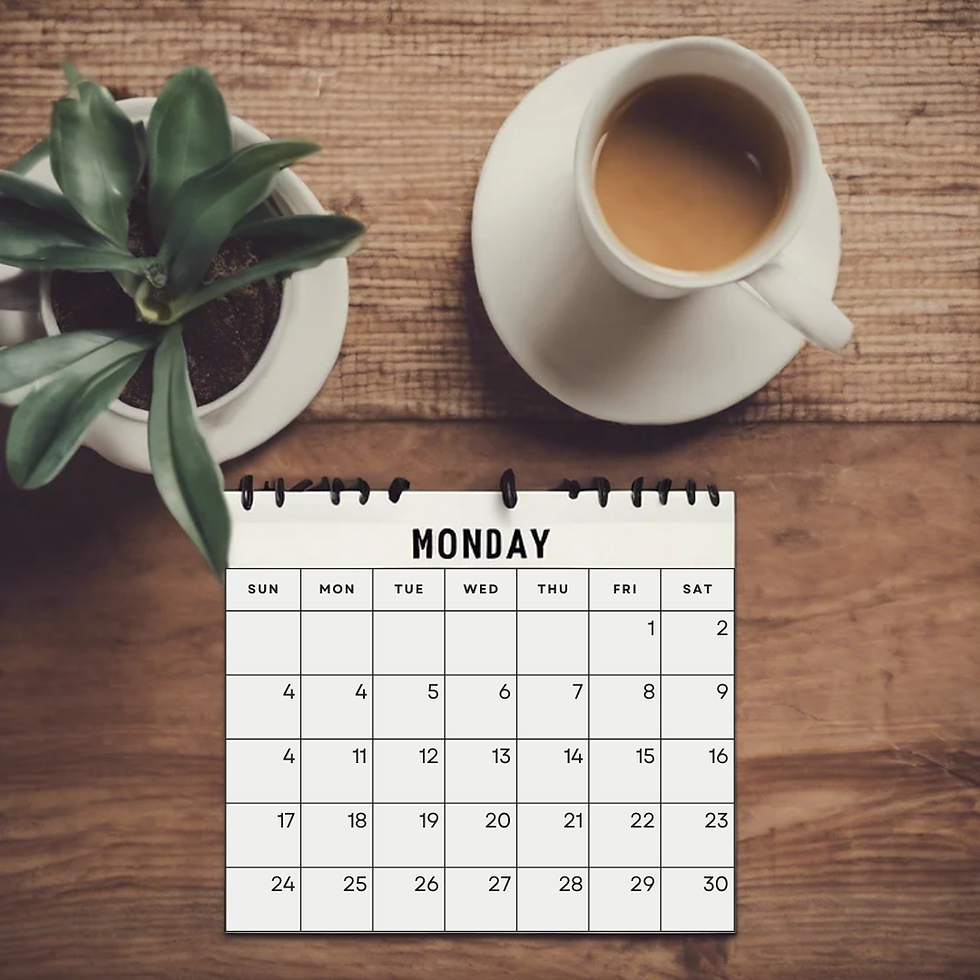 Calendar on wooden table reads "Monday." Nearby, a cup of coffee and a potted plant add a cozy vibe.