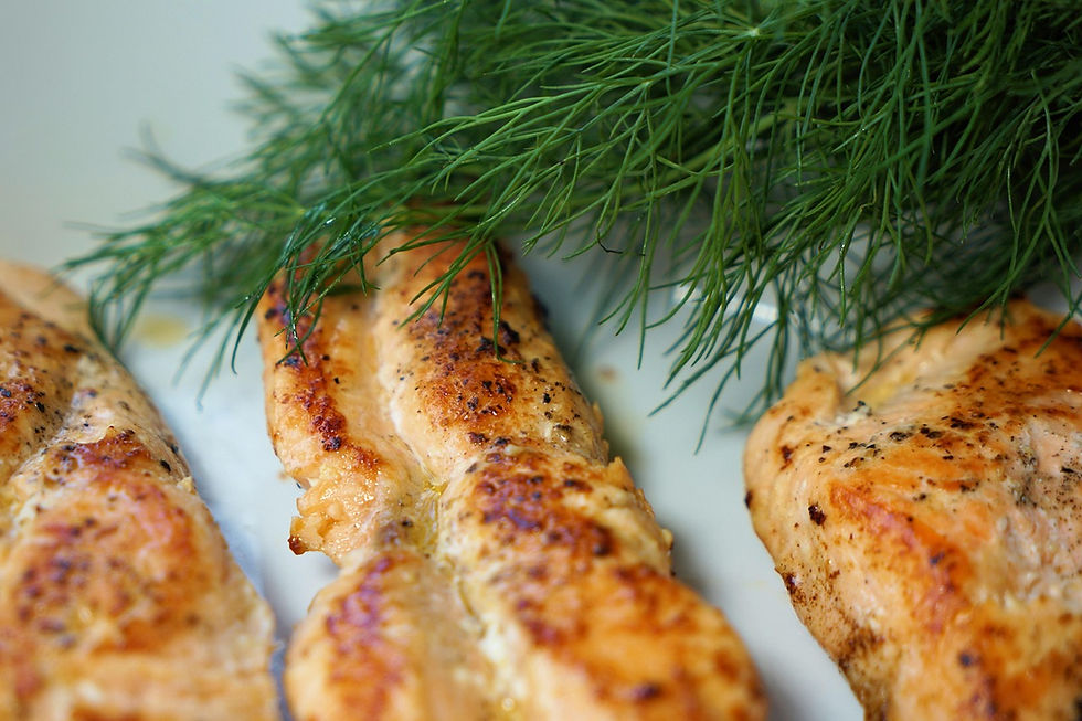 Cooked salmon fillet garnished with fresh dill