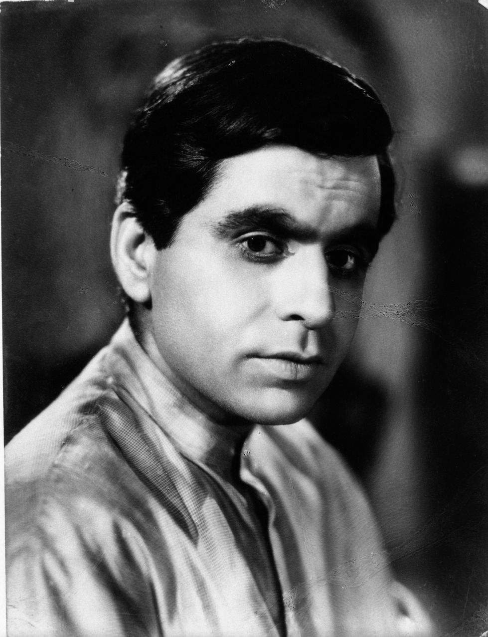 a man 's face is shown in a black and white photo