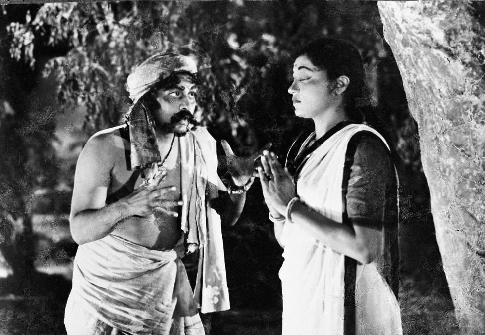 a black and white photo of a man and a woman