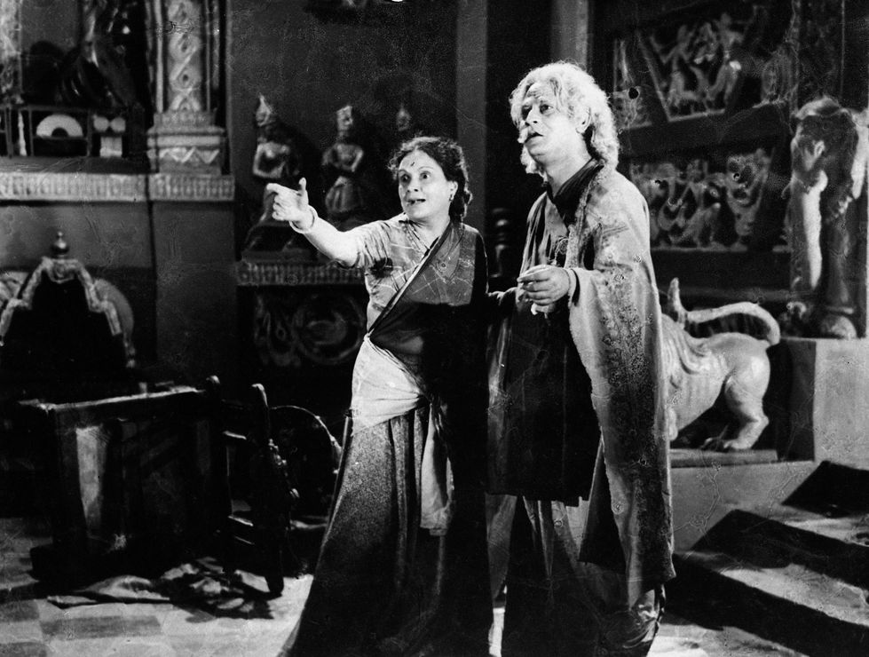 a black and white photo of a man and a woman