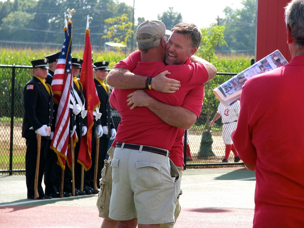 Kim Nuxhall (left) and Sean Casey embrace in July 2022 ahead of the inaugural Miracle Series game at Joe Nuxhall Miracle League Fields in Fairfield. Since this time, Casey’s Clubhouse and the Joe Nuxhall Miracle League have traveled to other Miracle League organizations to play, including Nuxhall taking a team of all-stars to Pittsburgh in 2024.