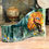 Thumbnail: A textured fused glass art piece featuring a fall tree and wildflowers.  A small bluebird sits in the tree on a green and white background.  