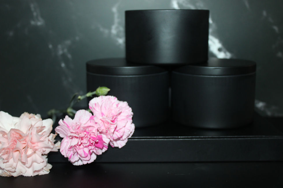 A 3-pack bundle of handcrafted luxury candles, showcasing an assortment of scents and colors, beautifully arranged for a perf