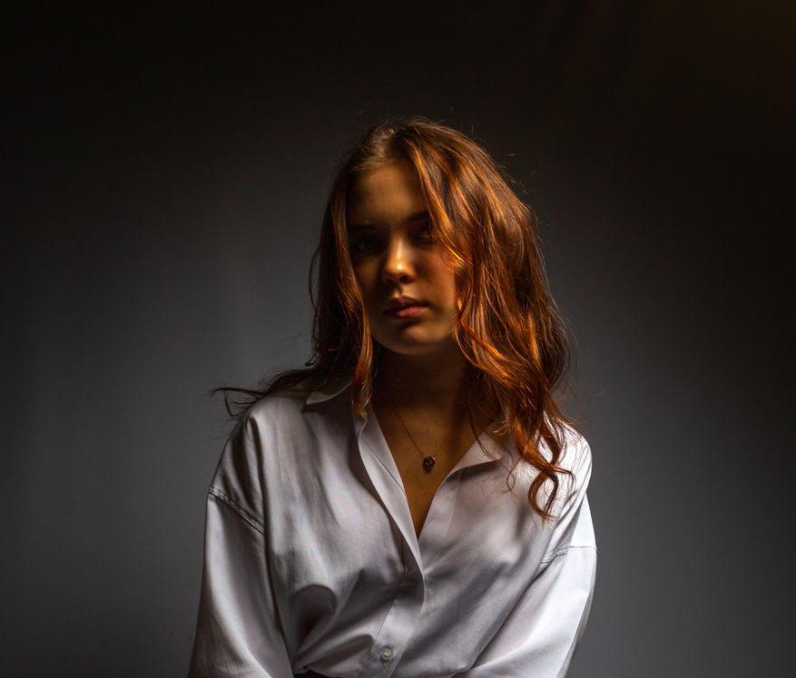 Studio shoot with Arisha Cherkashina, evoking a vintage feel with her classic pose in grayscale.