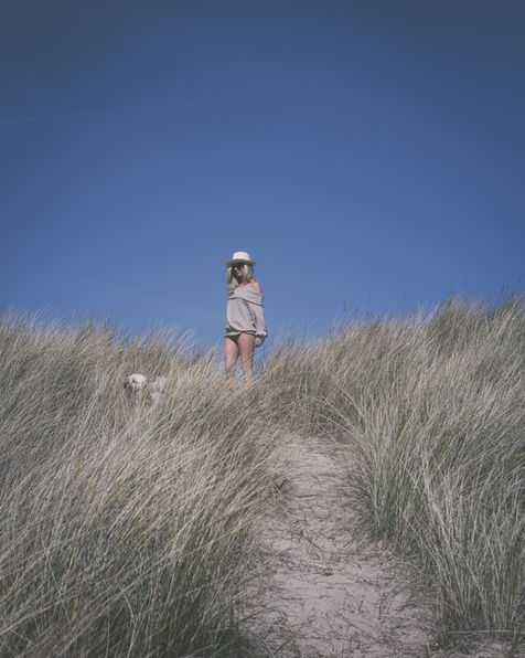Candid capture of Fae Kennedy by the gentle Holkham waves.