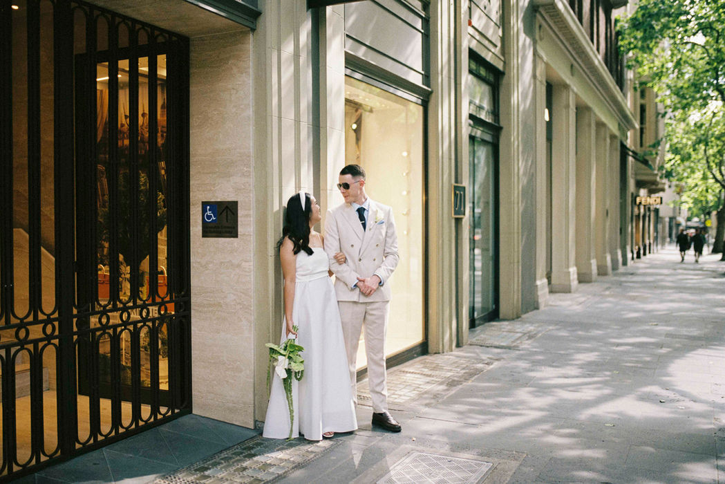 Couple exchange heartfelt looks in the city streets