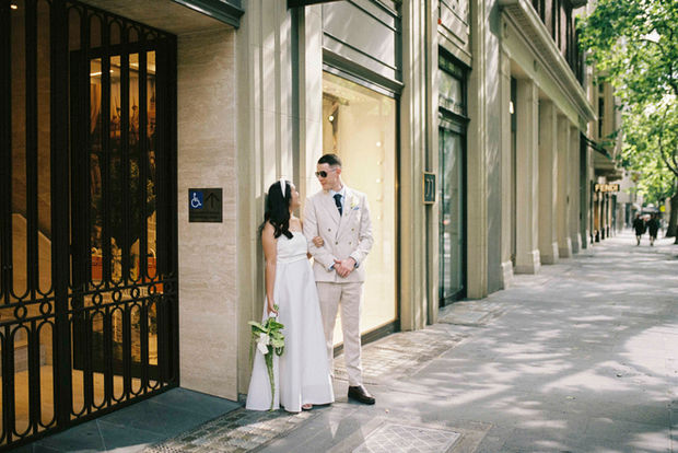Couple exchange heartfelt looks in the city streets