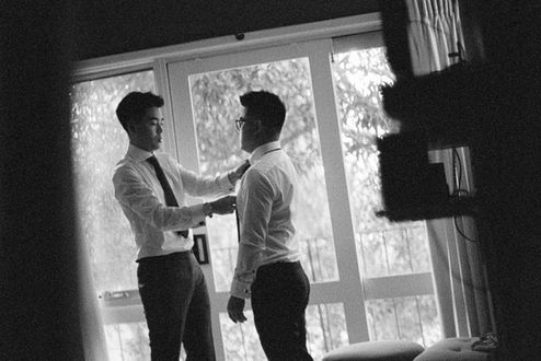 Groom and his groomsmen make the final adjustments