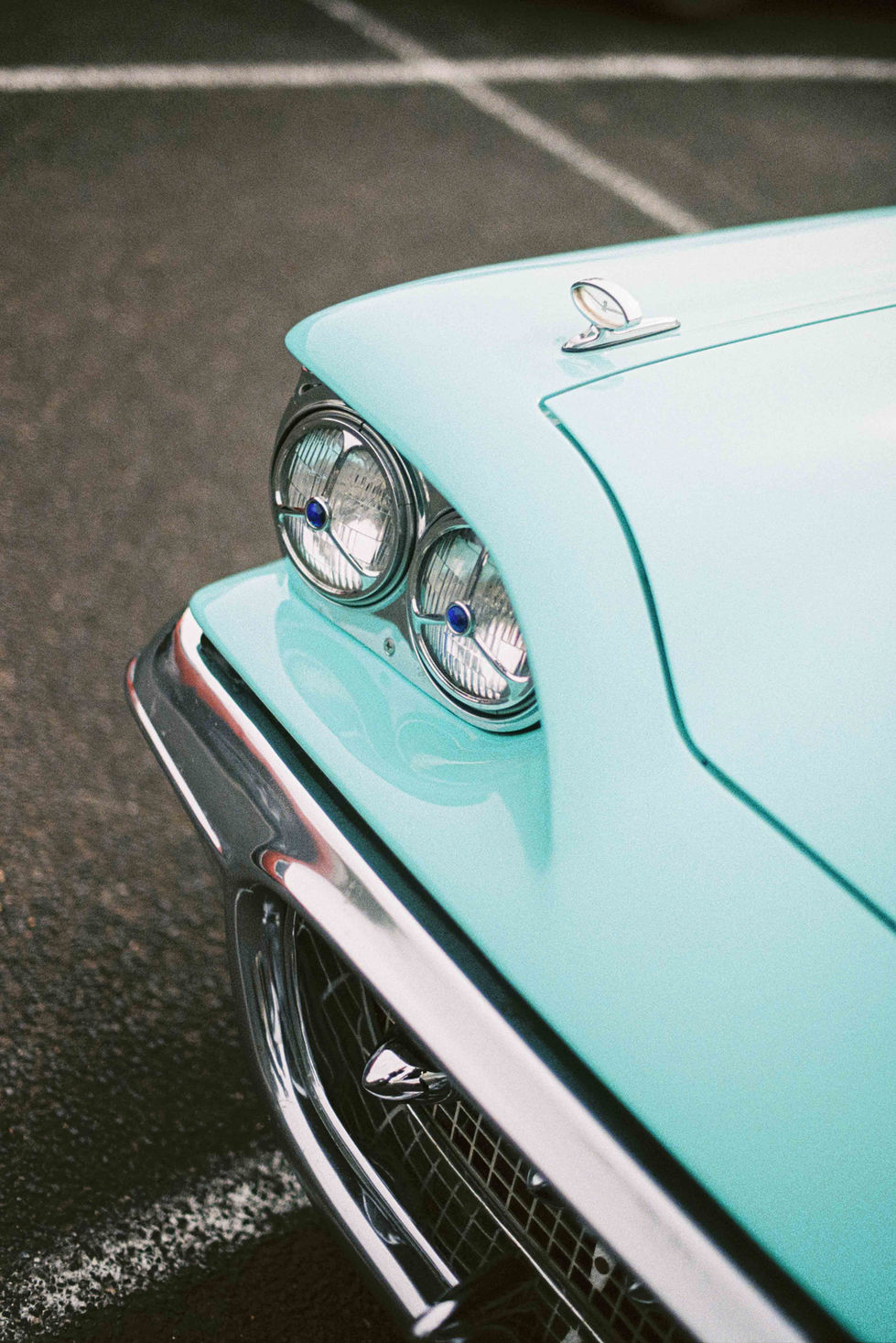 a close up of the front of a blue car