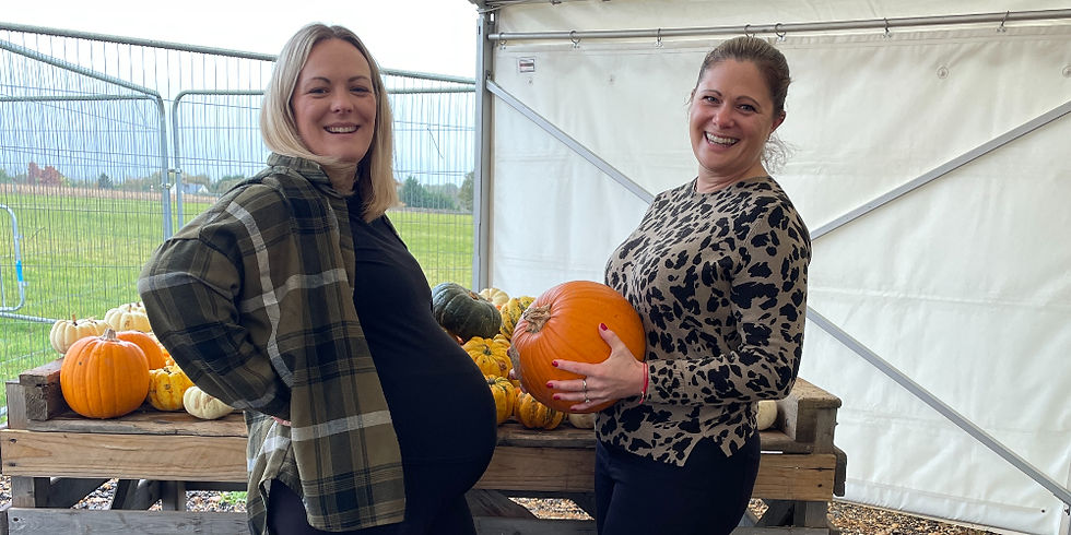 Emily Hewett and her sister comparing pumpkins at a local pumpkin patch – symbolising growth, nurture, and the importance of caring for yourself and your business.