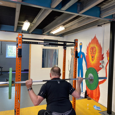 Personal training client doing strength exercises