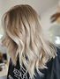 Blonde premium hair extensions styled at Mila’s House of Hair