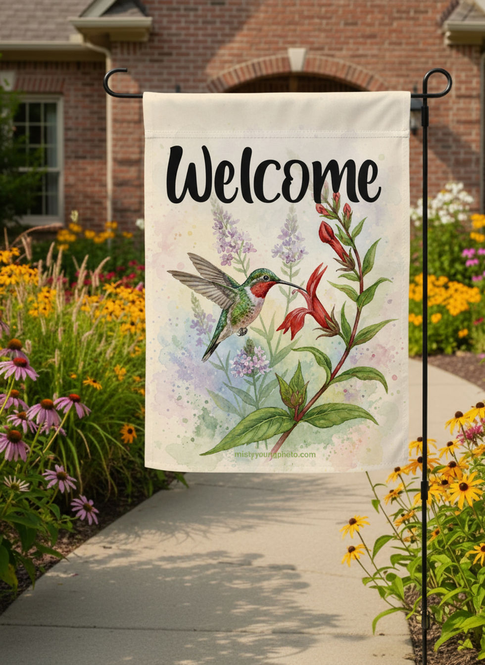 Welcome Garden Flag Featuring a Ruby Throated Hummingbird sipping nectar from native plants and flowers