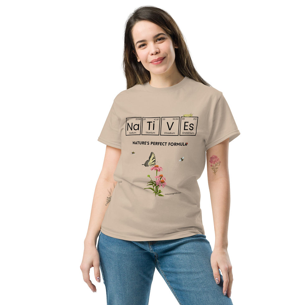 Thumbnail: NATIVES – Periodic Table Nature Tee worn by young woman holding a flower in a garden