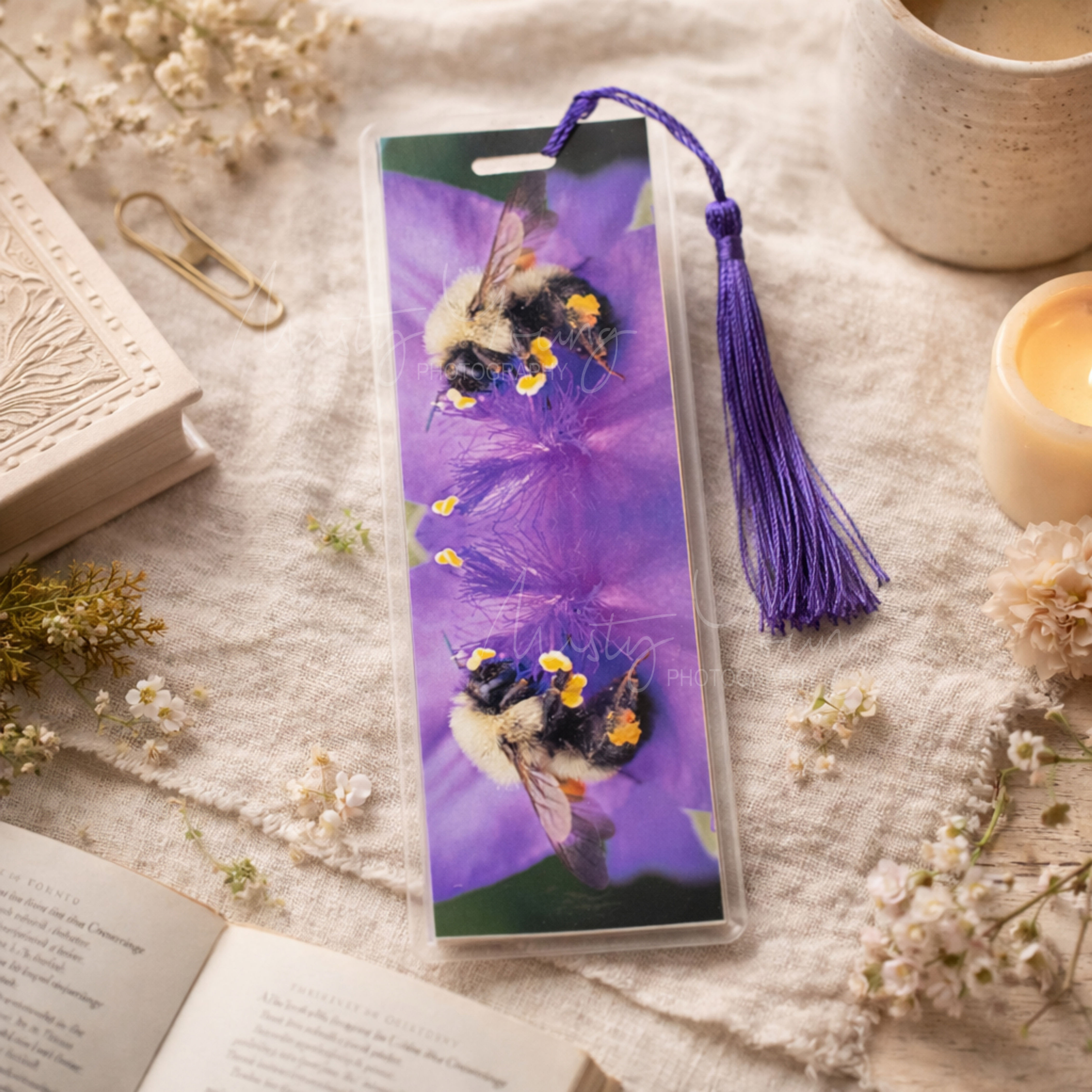 Elegant laminated handmade bookmark with a close up image of a fuzzy native bumblebee &  tassel