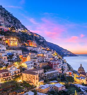 Positano, Italy along the Amalfi Coast at dusk..jpg