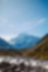A river running through a valley with mountains in the background_edited.jpg
