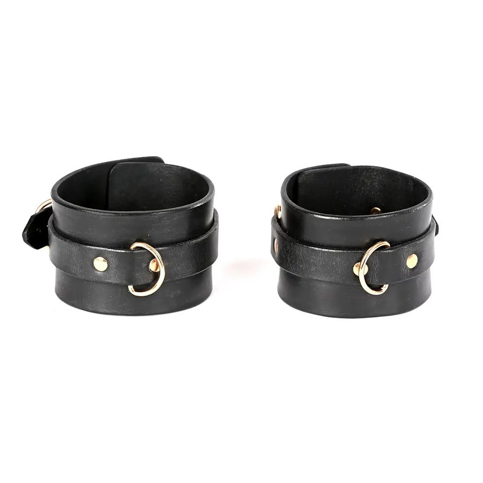 Ankle cuffs made of smooth calfskin with gold hardware.