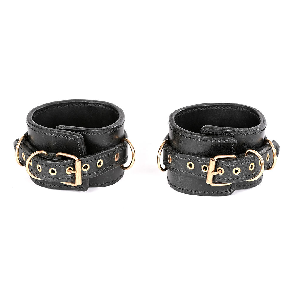 Double-layer calfskin ankle cuffs with a gold buckle and fastening strap, decorated with gold eyelets.