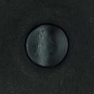 Black thread subtly sewn into black leather.