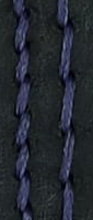 Purple thread contrasting with black leather.